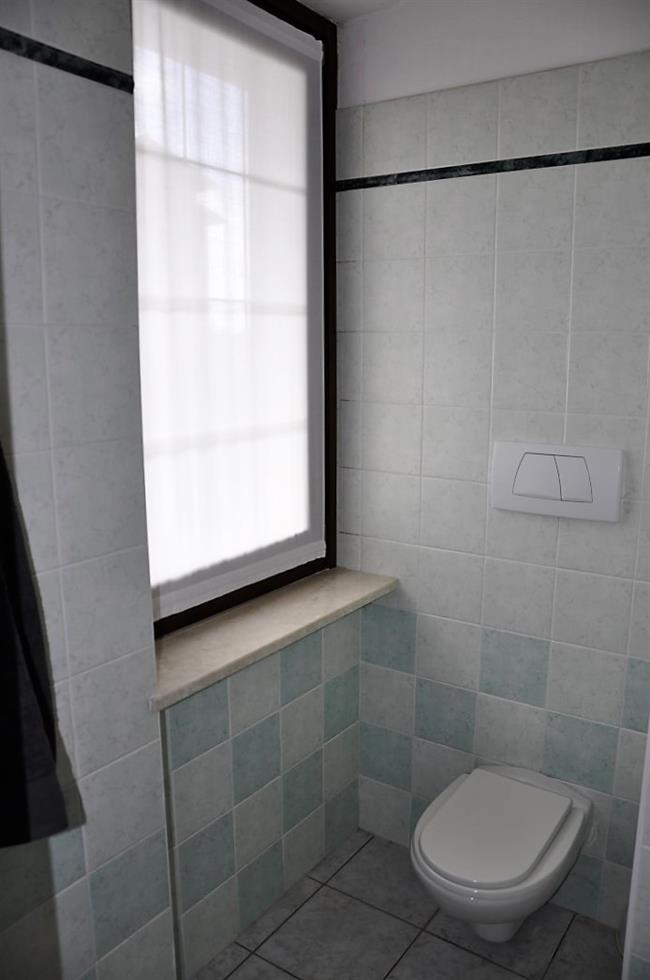 bathroom with shower and washing machine