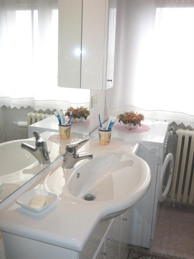 bathroom with shower and washing machine