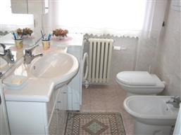 bathroom with shower and washing machine